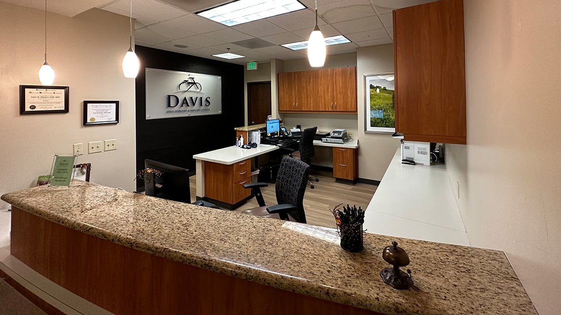 front desk with logo wall